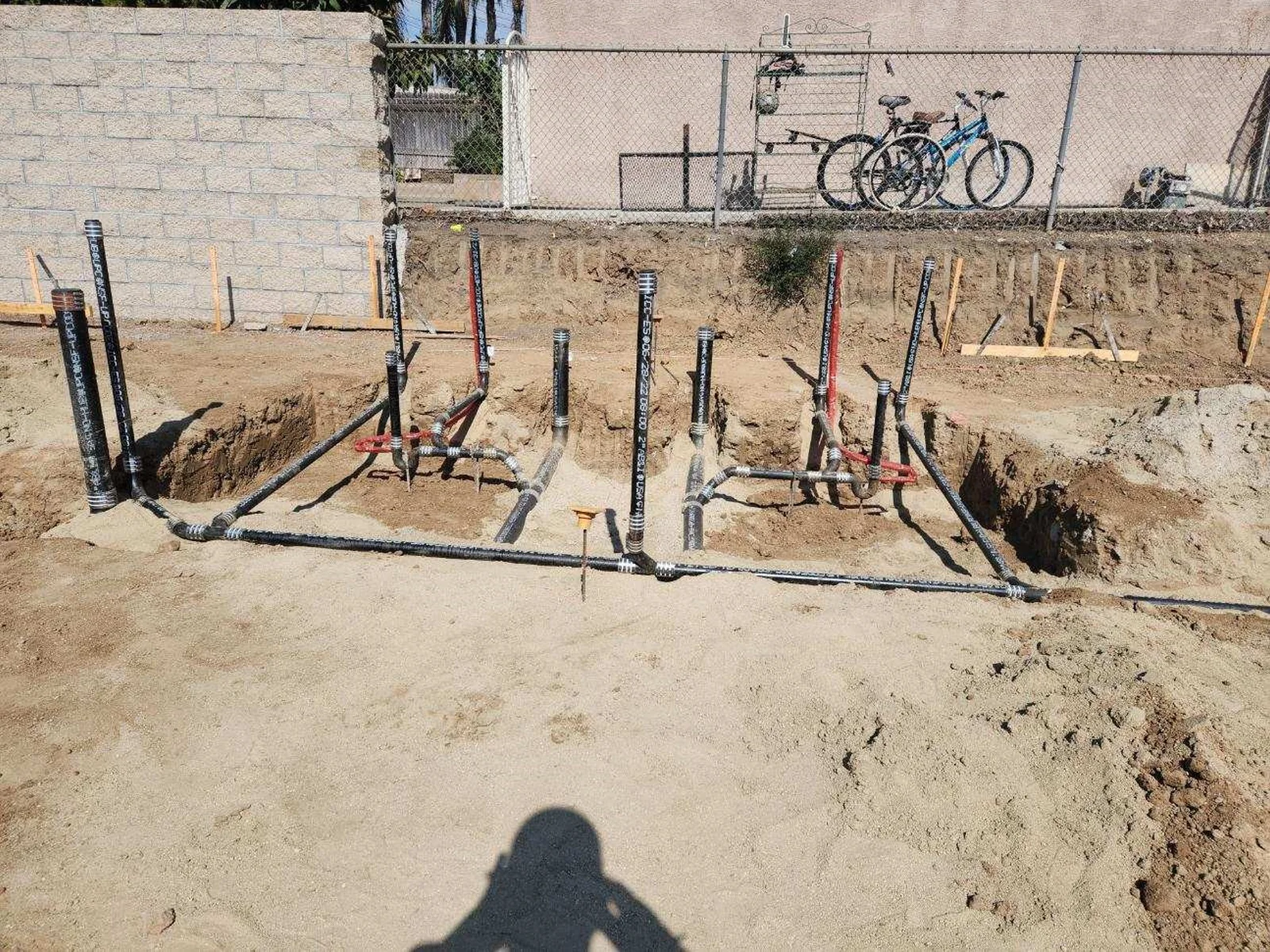 Underground plumbing rough-in installed before concrete placement